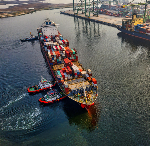 Cargo ship navigating international trade waters.